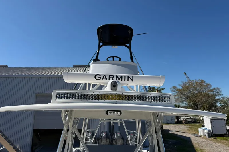 Slide: The Image of 2021 SeaVee 390Z boat with Garmin radar and light bar, docked outdoors. - 19