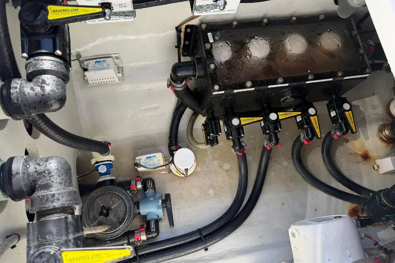 Slide: The Image of Engine compartment of 2021 SeaVee 390Z boat with visible plumbing and valves. - 23