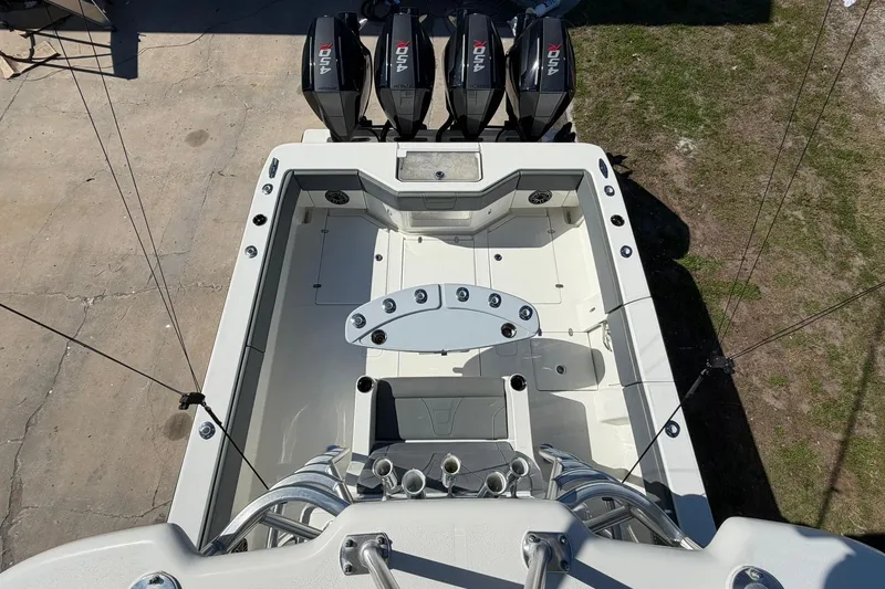 Slide: The Image of 2021 SeaVee 390Z boat deck with quad outboard engines, viewed from above. - 31