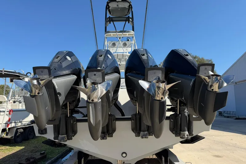Slide: The Image of 2021 SeaVee 390Z boat with four powerful outboard engines, viewed from the rear. - 4