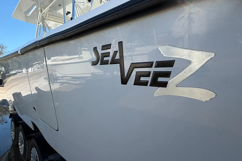 Slide: The Image of 2021 SeaVee 390Z boat side view with logo, parked on a trailer. - 6
