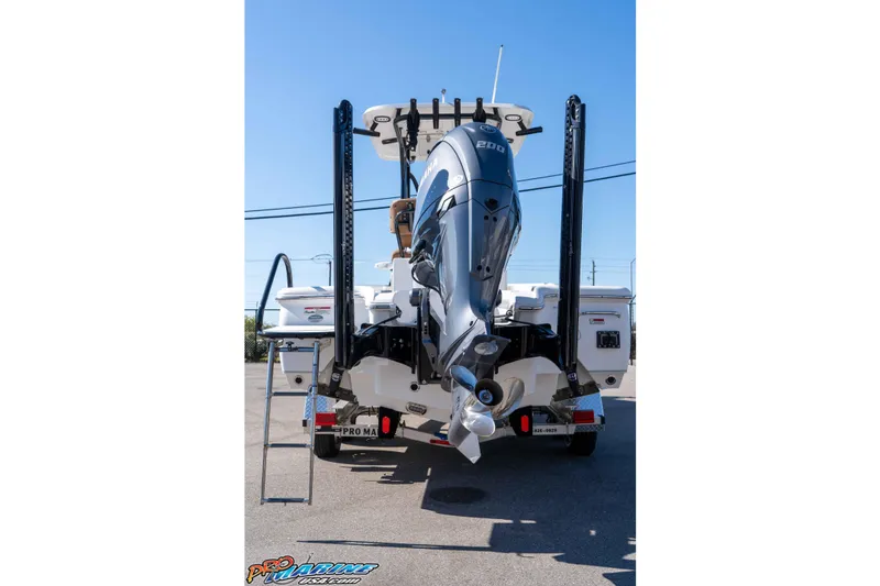 Slide: The Image of 2024 Sea Hunt BX 22 BR boat rear view with powerful outboard motor. - 11
