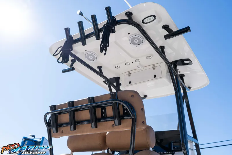 Slide: The Image of 2024 Sea Hunt BX 22 BR boat with T-top and rod holders under clear sky. - 15