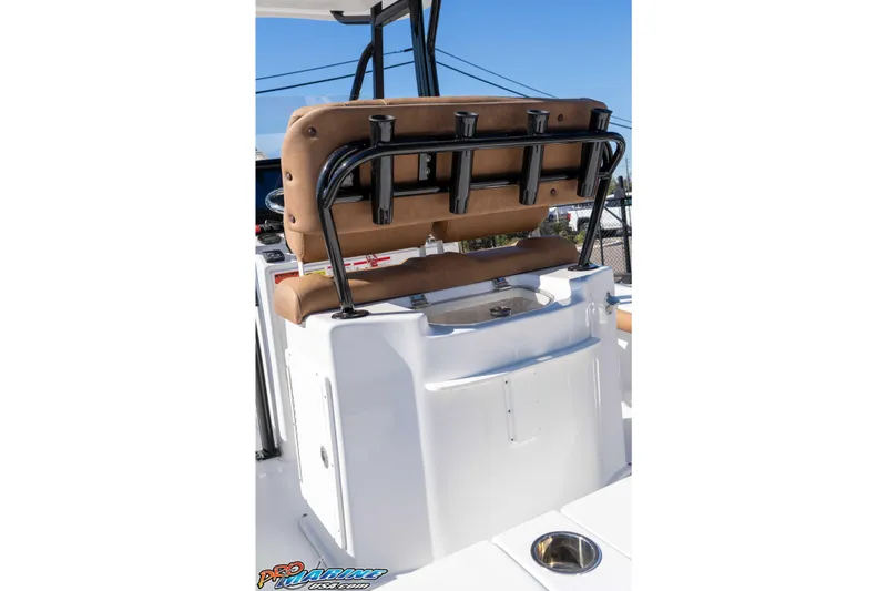 Slide: The Image of 2024 Sea Hunt BX 22 BR boat interior with cushioned seating and rod holders. - 20