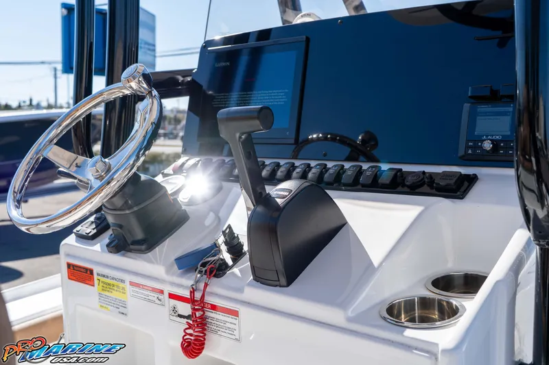 Slide: The Image of 2024 Sea Hunt BX 22 BR boat console with steering wheel and controls. - 22