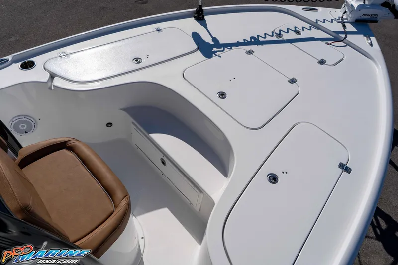 Slide: The Image of 2024 Sea Hunt BX 22 BR boat deck with storage compartments and seating. - 24