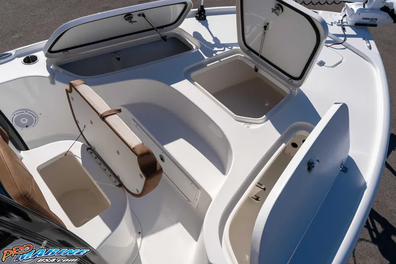 Slide: The Image of 2024 Sea Hunt BX 22 BR boat with open storage compartments and seating. - 25