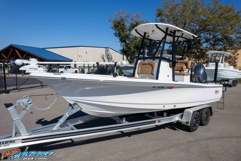 Slide: The Image of 2024 Sea Hunt BX 22 BR boat on trailer, displayed outdoors. - 27