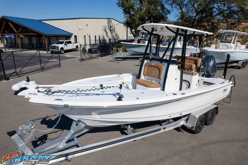 Slide: The Image of 2024 Sea Hunt BX 22 BR boat on trailer, displayed outdoors at a dealership. - 28