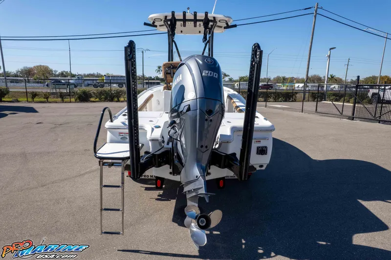Slide: The Image of 2024 Sea Hunt BX 22 BR boat with Yamaha 200 engine, parked outdoors. - 34