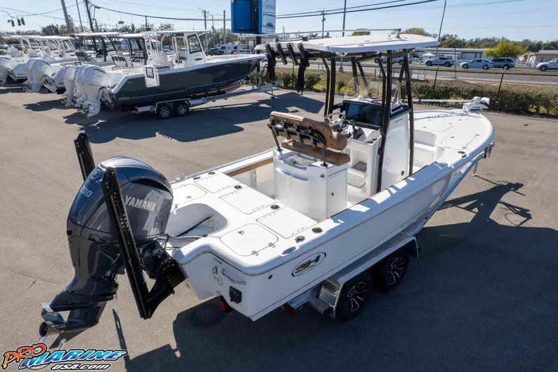 Slide: The Image of 2024 Sea Hunt BX 22 BR boat with Yamaha engine, parked at a dealership. - 37