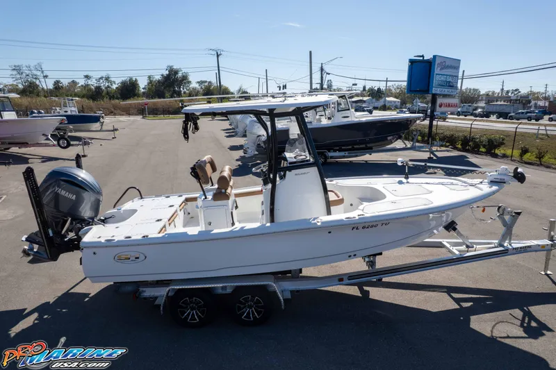 Slide: The Image of 2024 Sea Hunt BX 22 BR boat on trailer at dealership, featuring Yamaha outboard motor. - 40