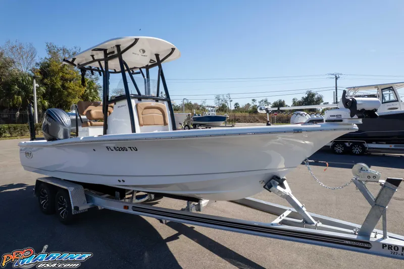 Slide: The Image of 2024 Sea Hunt BX 22 BR boat on trailer, sunny day, outdoor setting. - 42