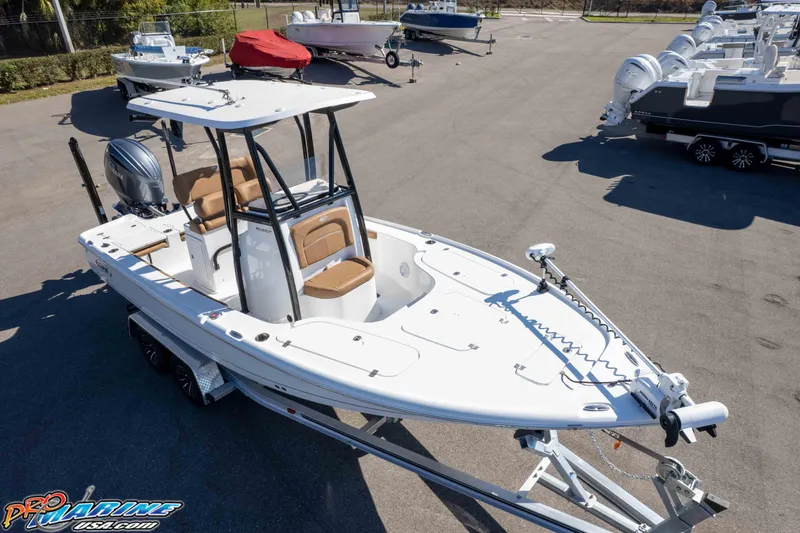 Slide: The Image of 2024 Sea Hunt BX 22 BR boat on trailer in marina lot. - 43