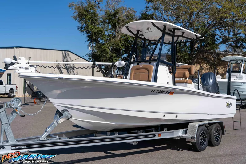 Slide: The Image of 2024 Sea Hunt BX 22 BR boat on trailer, displayed outdoors, featuring sleek design. - 7