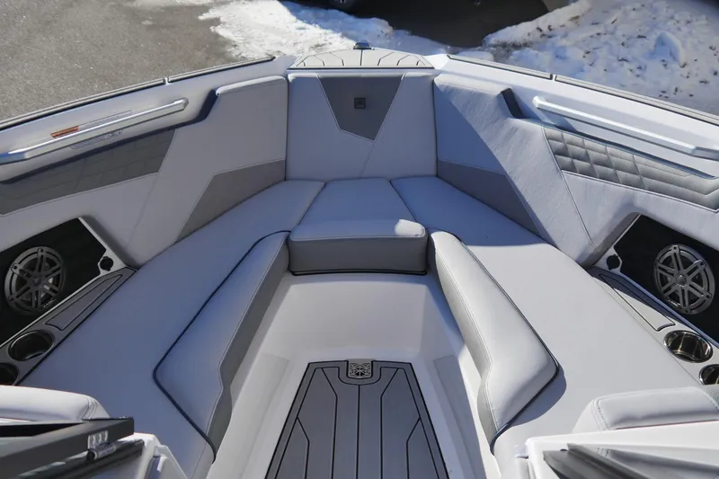 Slide: The Image of Luxurious interior of 2026 Nautique Super Air Nautique S23 boat with plush seating. - 11