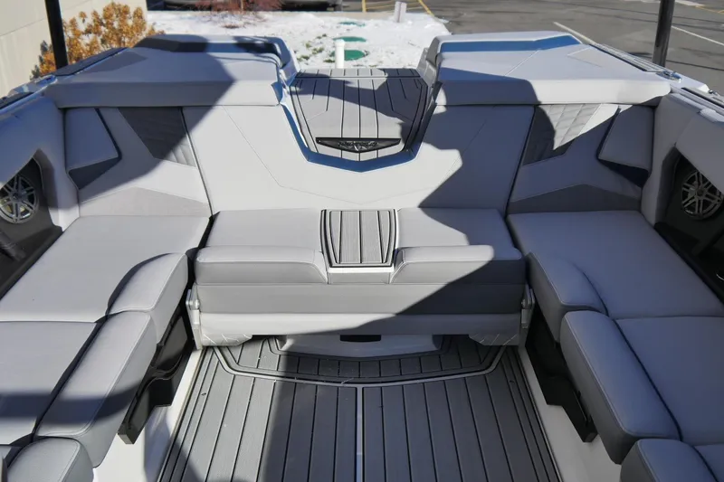 Slide: The Image of 2026 Nautique Super Air Nautique S23 interior with gray seating and modern design. - 12