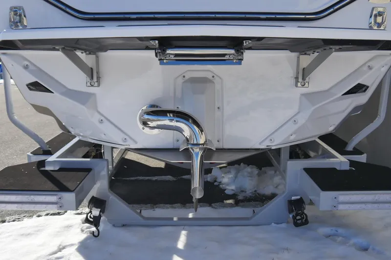 Slide: The Image of 2026 Nautique Super Air Nautique S23 boat stern with snow-covered ground. - 3