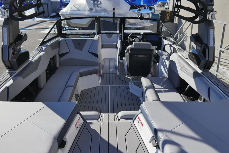 Slide: The Image of 2026 Nautique Super Air Nautique S23 boat interior with modern seating and sleek design. - 4
