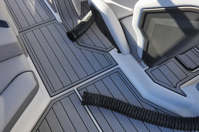 Slide: The Image of 2026 Nautique Super Air Nautique S23 interior with sleek seating and flooring design. - 9