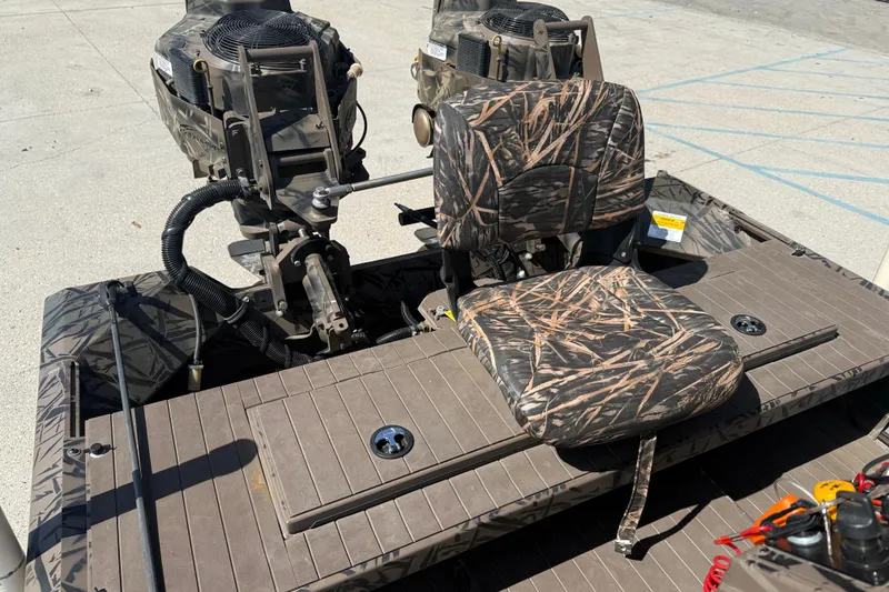 Slide: The Image of 2022 Pro-Drive SBX 2060x boat with camo seat and dual motors. - 13