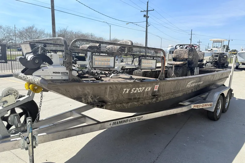 Slide: The Image of 2022 Pro-Drive SBX 2060x boat on trailer, featuring Minn Kota Terrova motor. - 3