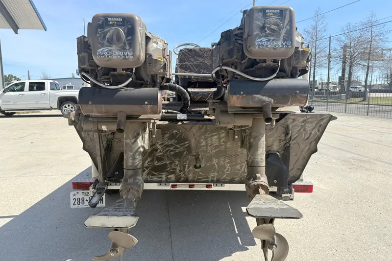 Slide: The Image of Rear view of a 2022 Pro-Drive SBX 2060x boat with dual outboard motors. - 5