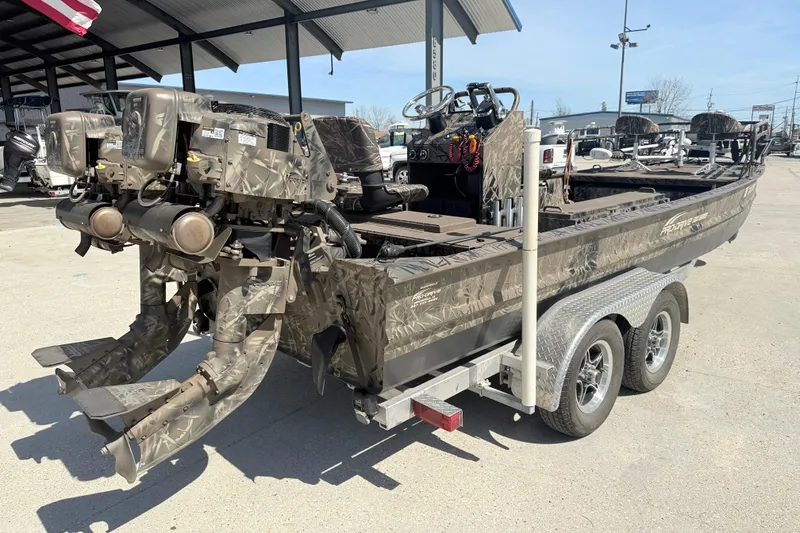 Slide: The Image of 2022 Pro-Drive SBX 2060x boat with camouflage design on a trailer. - 6