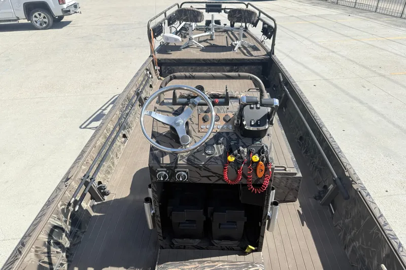 Slide: The Image of 2022 Pro-Drive SBX 2060x boat interior with steering wheel and controls. - 7