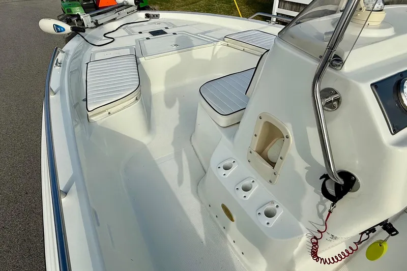 Slide: The Image of 2002 Bay Stealth 2030 boat interior with seating and control panel. - 11