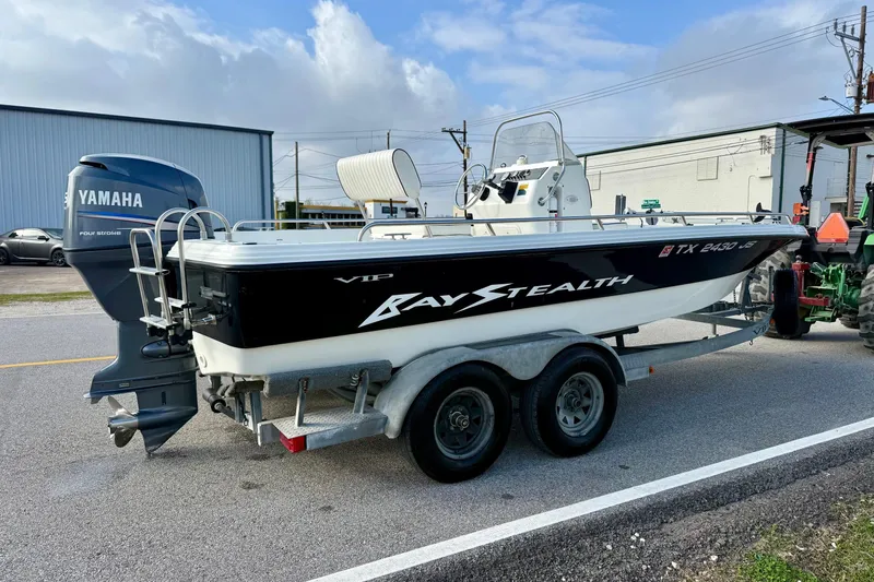 Slide: The Image of 2002 Bay Stealth 2030 boat on trailer with Yamaha outboard motor. - 4