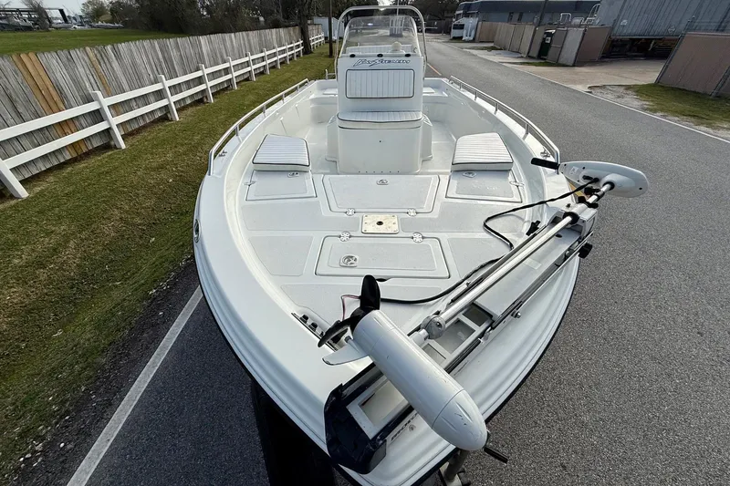 Slide: The Image of 2002 Bay Stealth 2030 boat with trolling motor on a paved road. - 6