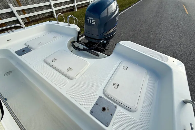 Slide: The Image of Bay Stealth 2030 boat, 2002 model, with Yamaha 115 outboard motor on a road. - 7