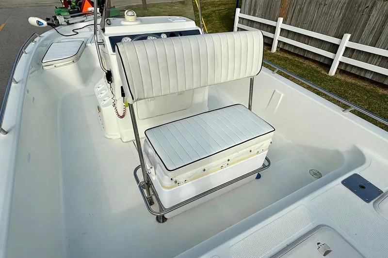 Slide: The Image of 2002 Bay Stealth 2030 boat interior with white seating and console. - 8