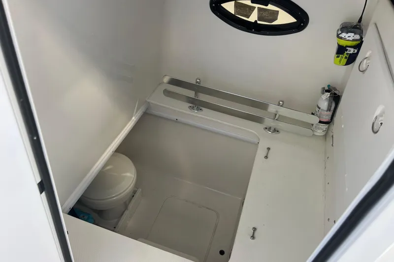 Slide: The Image of 2023 Contender 39 ST boat interior with toilet and safety equipment. - 10