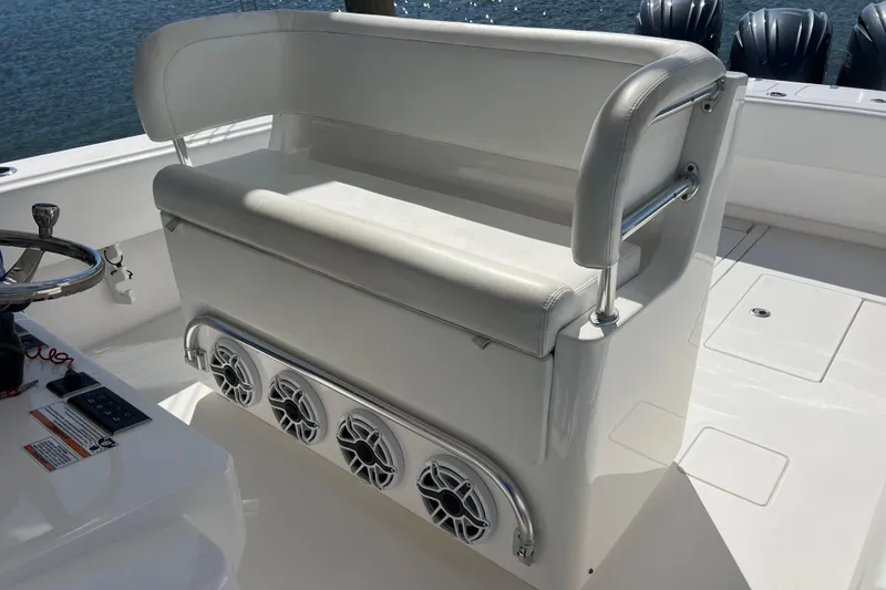 Slide: The Image of 2023 Contender 39 ST boat seat with integrated speakers and steering wheel. - 11