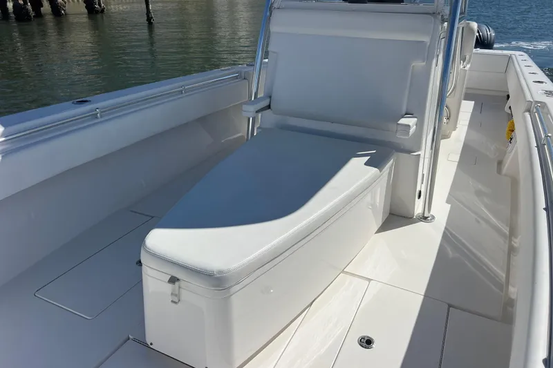 Slide: The Image of 2023 Contender 39 ST boat interior with white seating and sleek design. - 19