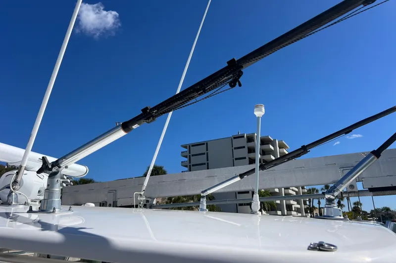 Slide: The Image of 2023 Contender 39 ST boat with rigging against a clear blue sky. - 35