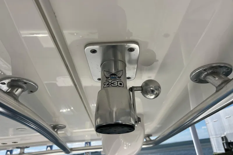 Slide: The Image of Close-up of a 2023 Contender 39 ST boat's Z-30 outrigger mount. - 38
