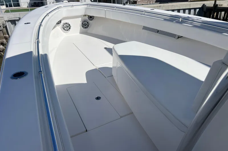Slide: The Image of 2023 Contender 39 ST boat interior with white seating and speakers. - 9