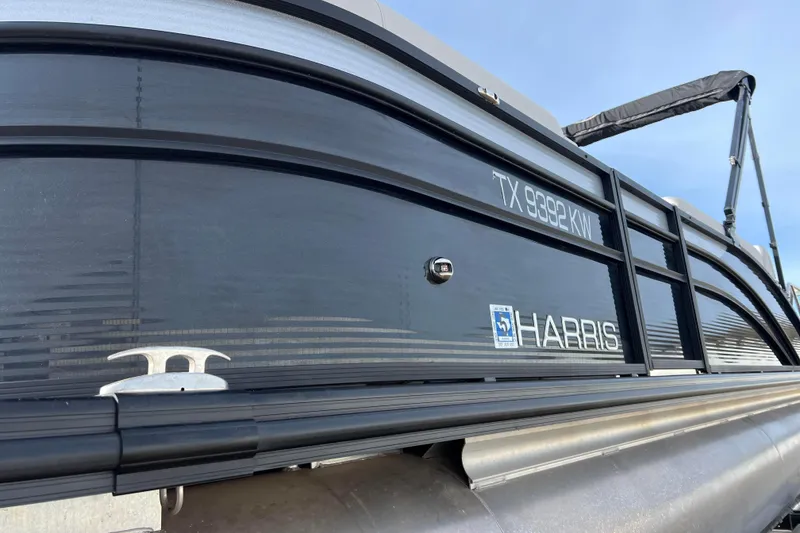 Slide: The Image of 2023 Harris Cruiser 210 SL pontoon boat, side view with registration number. - 12