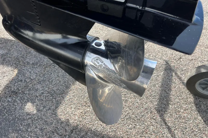 Slide: The Image of Close-up of a 2023 Harris Cruiser 210 SL boat propeller on pavement. - 17