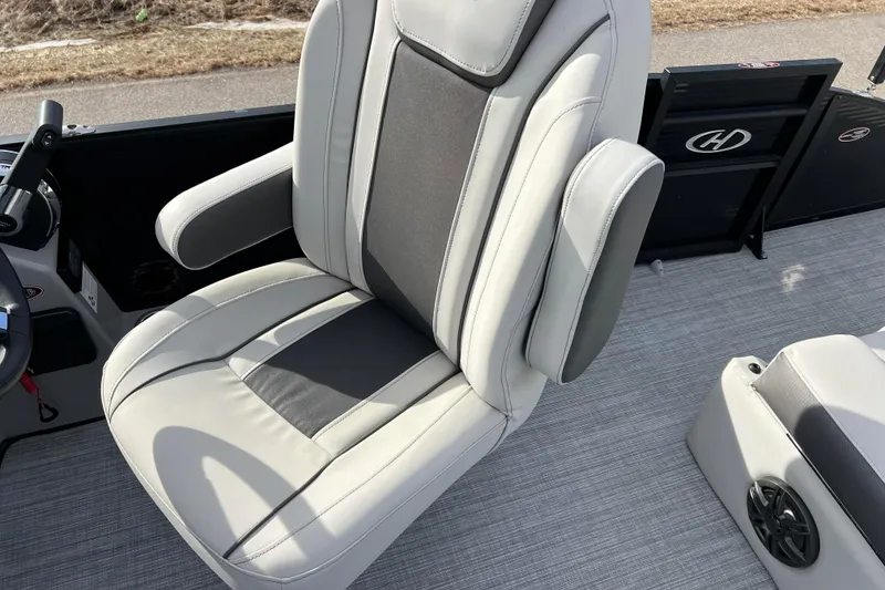 Slide: The Image of 2023 Harris Cruiser 210 SL boat seat with gray upholstery and armrests. - 31