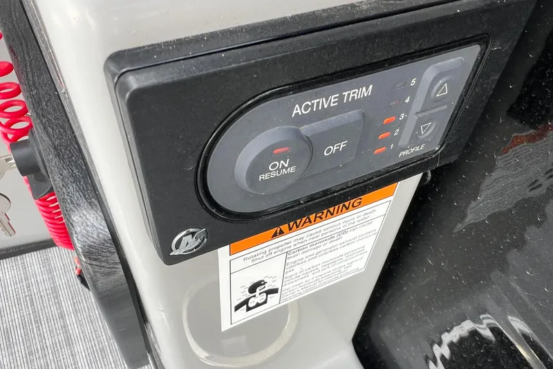 Slide: The Image of 2023 Harris Cruiser 210 SL active trim control panel with warning label. - 32