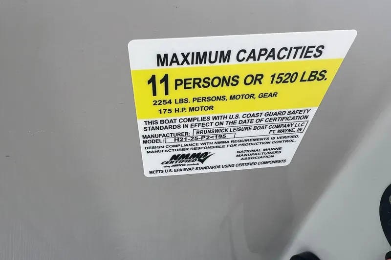 Slide: The Image of 2023 Harris Cruiser 210 SL capacity label: 11 persons or 1520 lbs, 175 HP motor. - 33