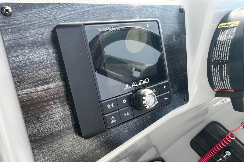 Slide: The Image of JL Audio MediaMaster control panel on 2023 Harris Cruiser 210 SL boat. - 36