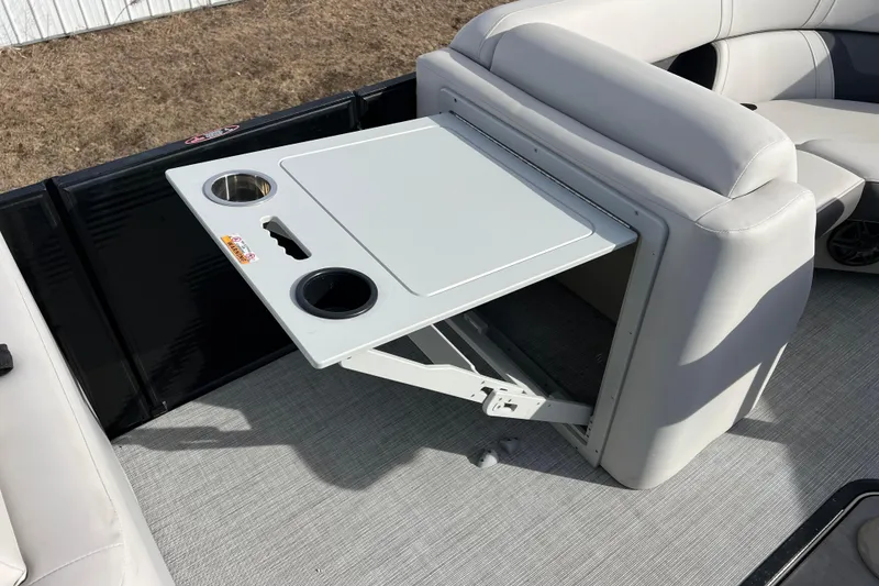 Slide: The Image of 2023 Harris Cruiser 210 SL boat with foldable table and cup holders. - 41