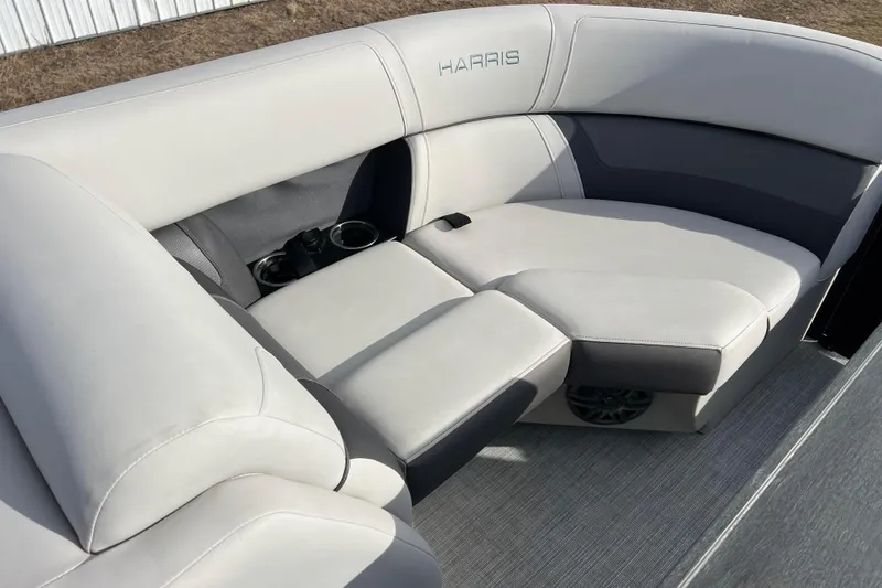 Slide: The Image of 2023 Harris Cruiser 210 SL boat interior with plush seating and cup holders. - 43