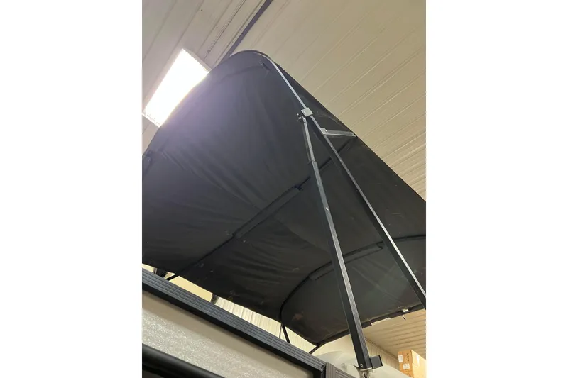 Slide: The Image of Bimini top of 2023 Harris Cruiser 210 SL indoors. - 46