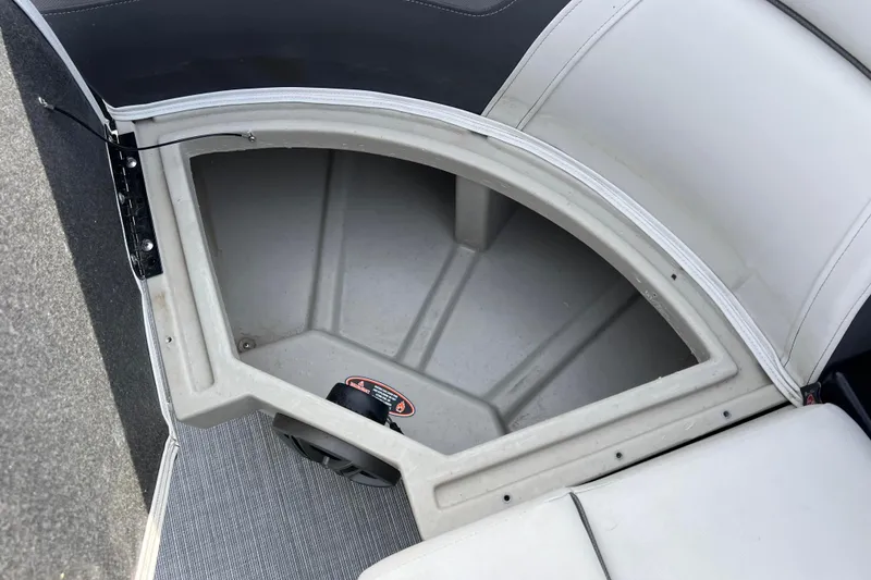 Slide: The Image of Storage compartment in 2023 Harris Cruiser 210 SL boat, featuring spacious interior and sleek design. - 47